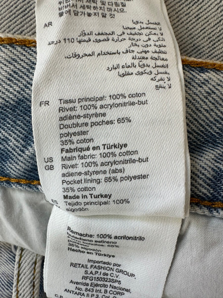 Jeans bleu motifs fleurs Sandro