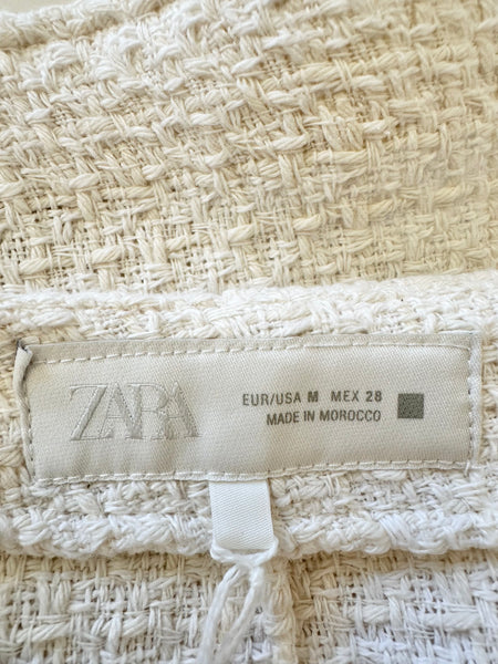 Short jupe en tweed beige